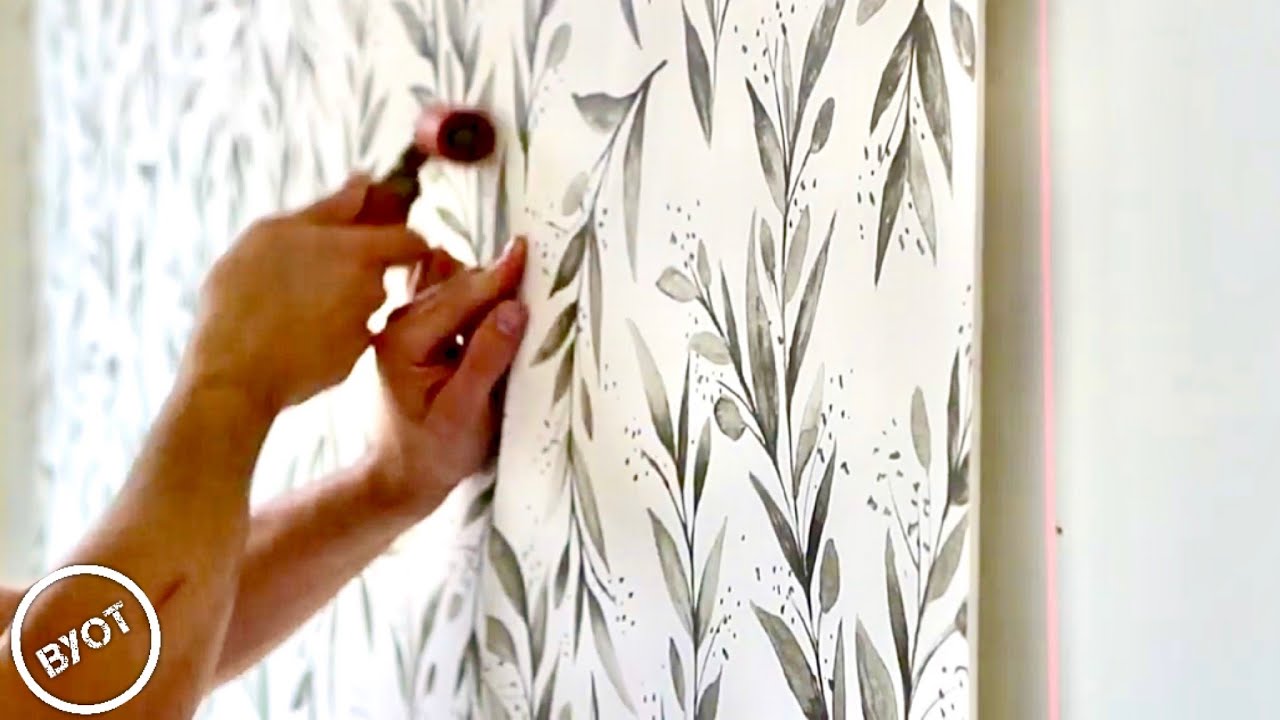 Professional wallpaper installation in progress
